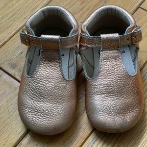 Gold T-strap Monkey Feet